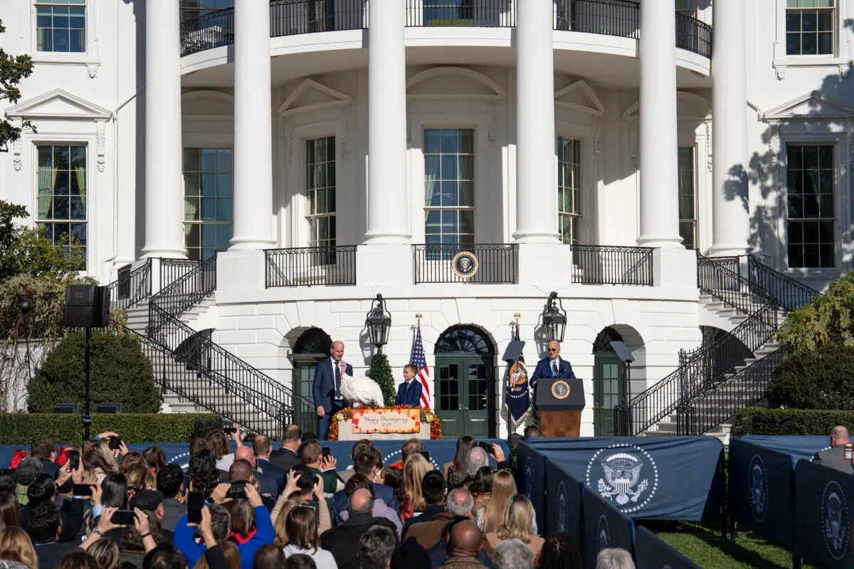 President Joe Biden (R) pardons Peach, the national Thanksgiving turkey, joined National Turkey Federation Chair John Zimmerman (L) and his son Grant at the South Lawn of the White House in Washington on Nov. 25, 2024. (Madalina Vasiliu/The Epoch Times)