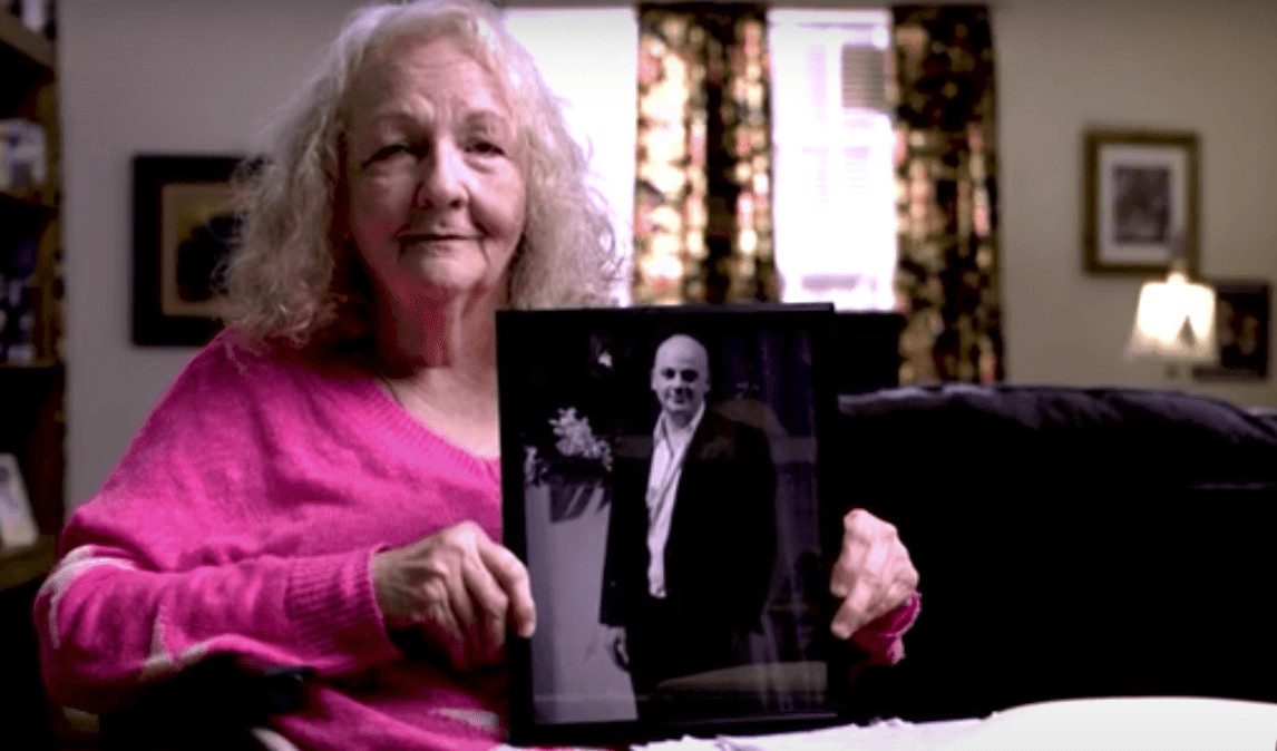 Texas resident Katherine Swidan holds a picture of her son Mark Swidan, who has been held in China for a decade. (Courtesy of the Swidan family)