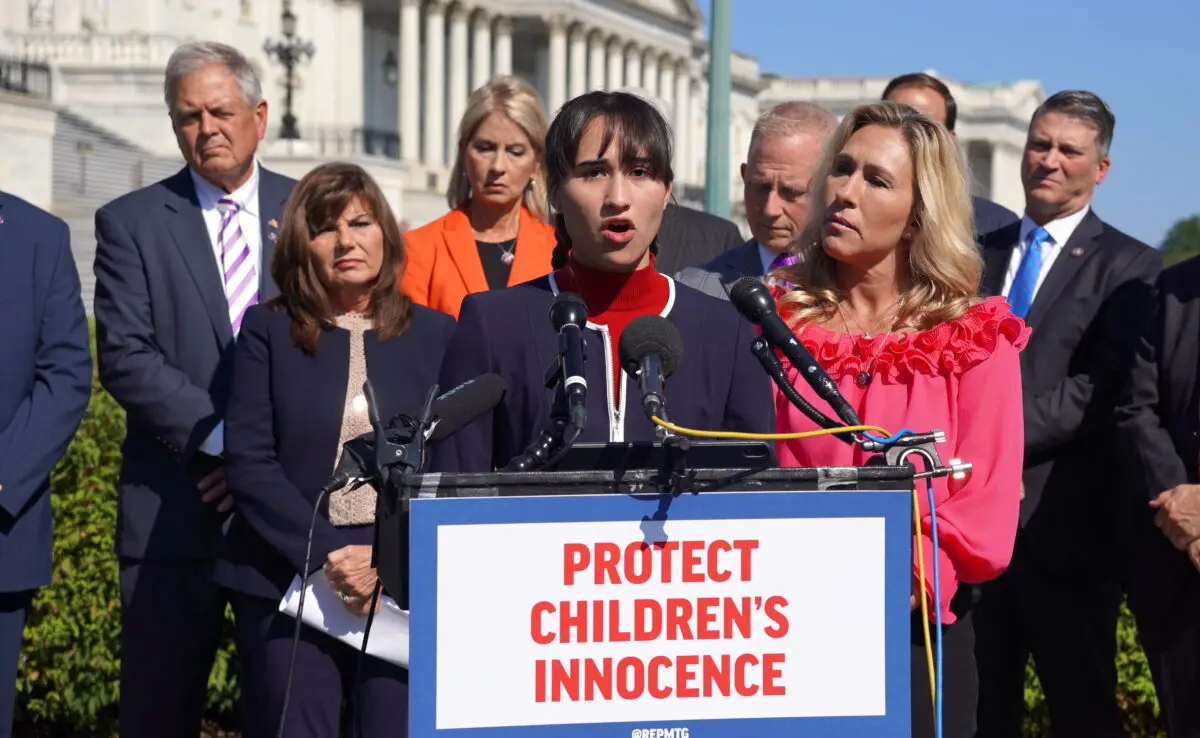 Chloe Cole, who speaks about surgeries and medication she took to try to live as a boy, speaks in support of the Protect Children's Innocence Act as Rep. Marjorie Taylor Greene (R-Ga.) looks on outside the U.S. Capitol on Sept. 20, 2022. (Terri Wu/The Epoch Times)