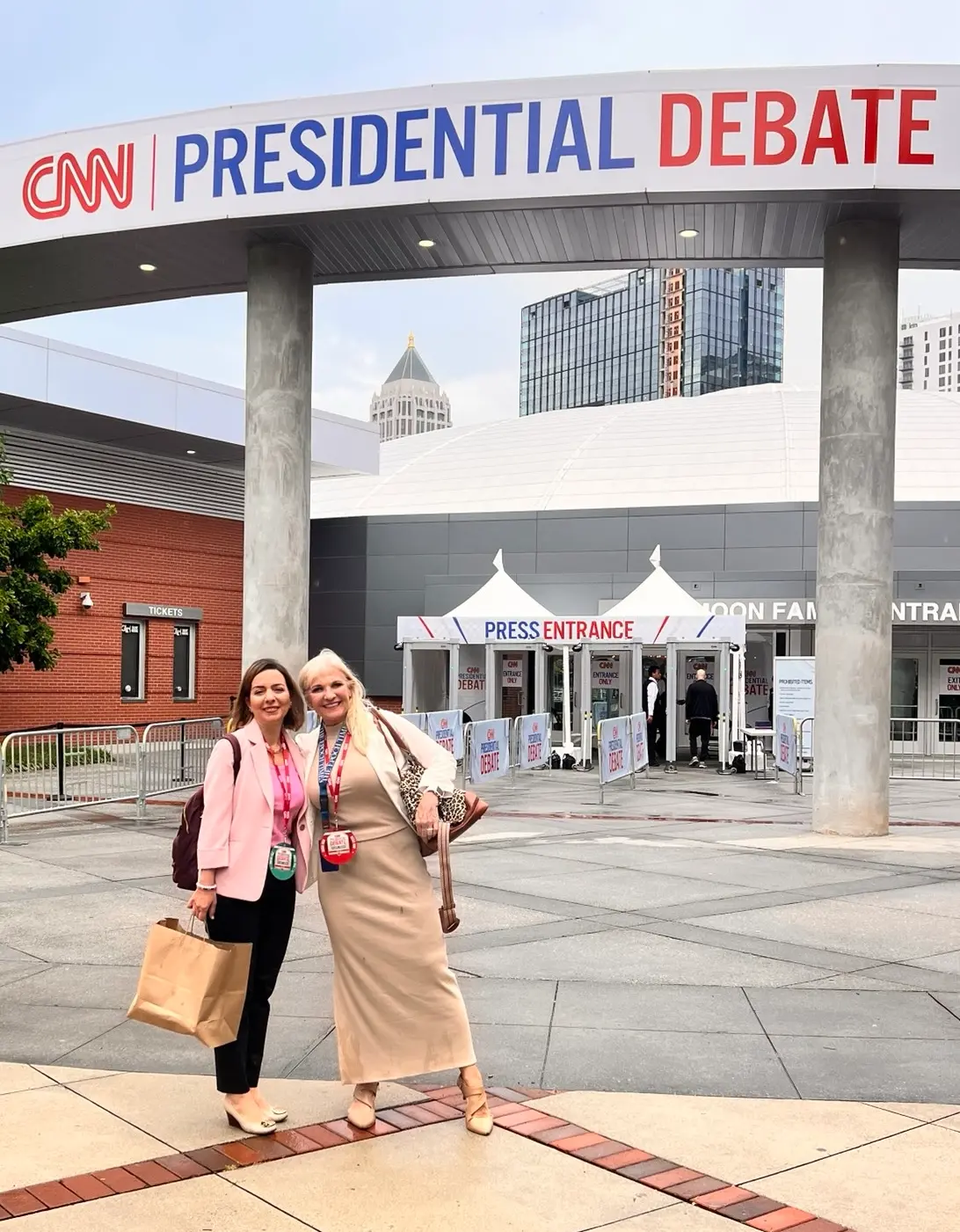 Epoch Times reporters Emel Akan (L) and Janice Hisle prepare to cover the presidential debate between President Joe Biden and former President Donald Trump in Atlanta on June 27, 2024. (Madalina Vasiliu/The Epoch Times)