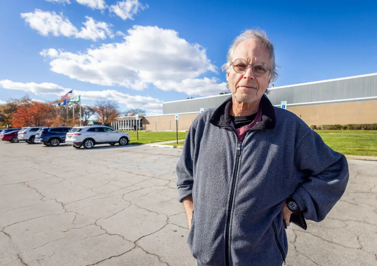 Bill Keller said he was discouraged by long lines on the first day of early voting in Farmington Hills, Mich., on Oct. 26, 2024.  (John Fredricks/The Epoch Times)