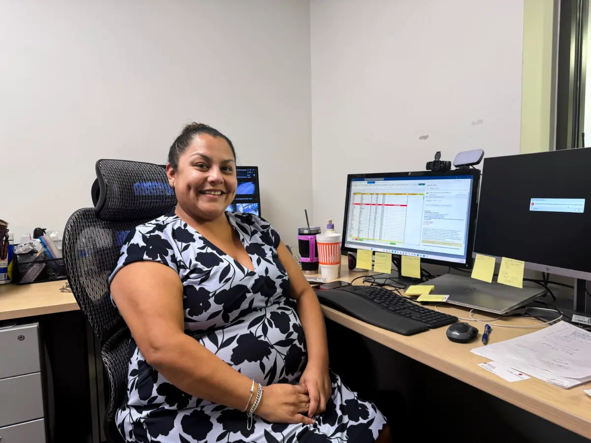 Adela Luna sits at her desk at her office in Houston, Texas, on Oct. 25, 2024. (Emel Akan/The Epoch Times)