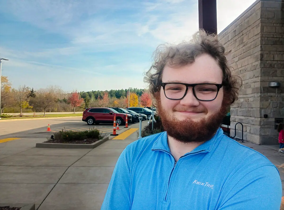 Craig, a Kwik Trip employee, poses for a photo in Mt. Pleasant, Wis., on Oct. 29, 2024. (Nathan Worcester/The Epoch Times)