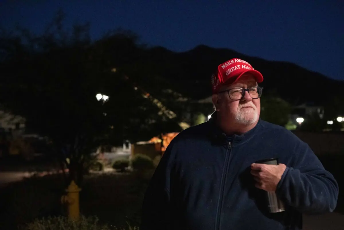 Tom Palmer waits outside polling center in Carefree, Ariz., on Nov 5, 2024. (Jason Koster for The Epoch times)