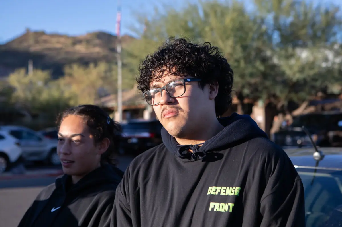 Xavier Worthy making final voting decissions outside the polling center in Cave Creek, Ariz., on Nov. 5, 2024. (Jason Koster for the Epoch times)