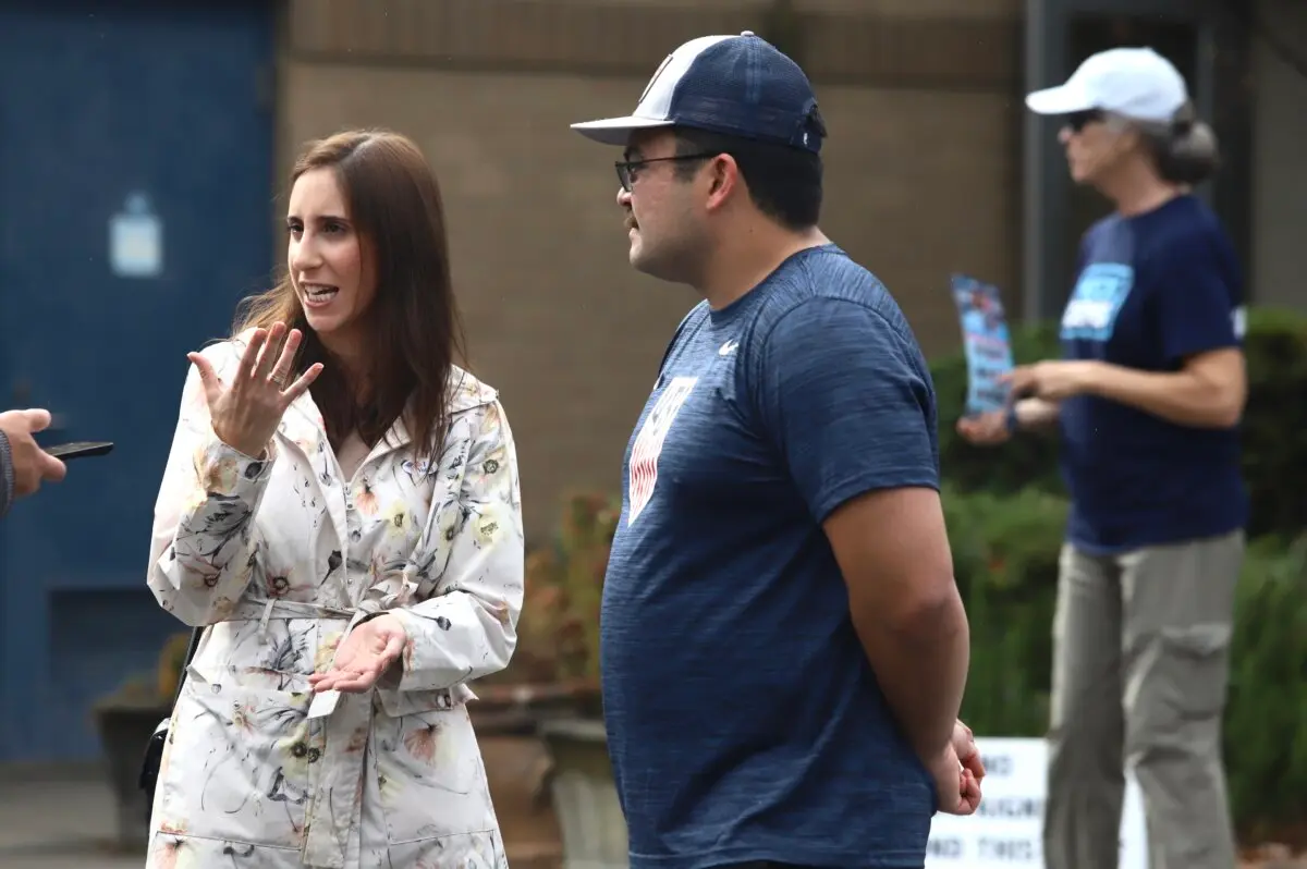 Renee Provost and her fiancée Christian Daniel speak to a reporter after having voted in Charlotte, N.C. on Nov. 5, 2024. Renee explained why she voted for Donald Trump in the presidential election, but Christian declined to say who he voted for. (Jennifer Podis for The Epoch Times)