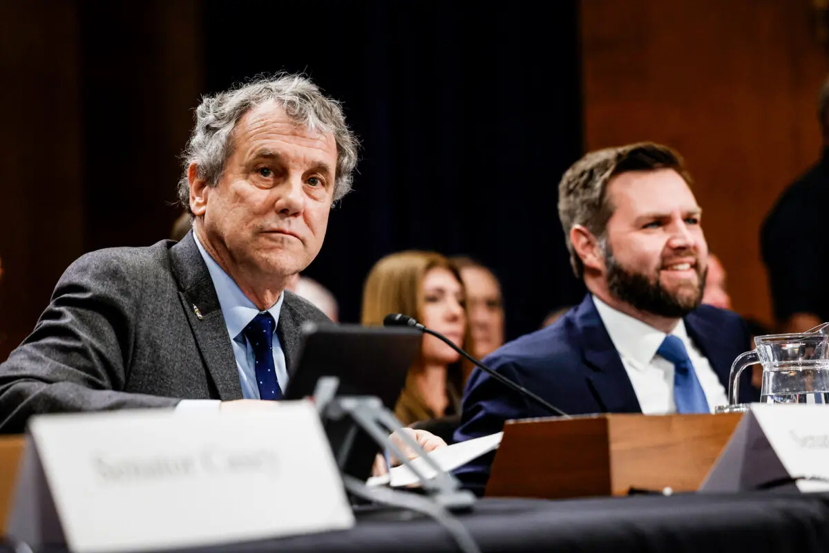 Sen. Sherrod Brown (D-Ohio) and Sen. JD Vance (R-Ohio) attend a panel with the Senate Environment and Public Works Committee at the U.S. Capitol, on March 9, 2023. (Anna Moneymaker/Getty Images)