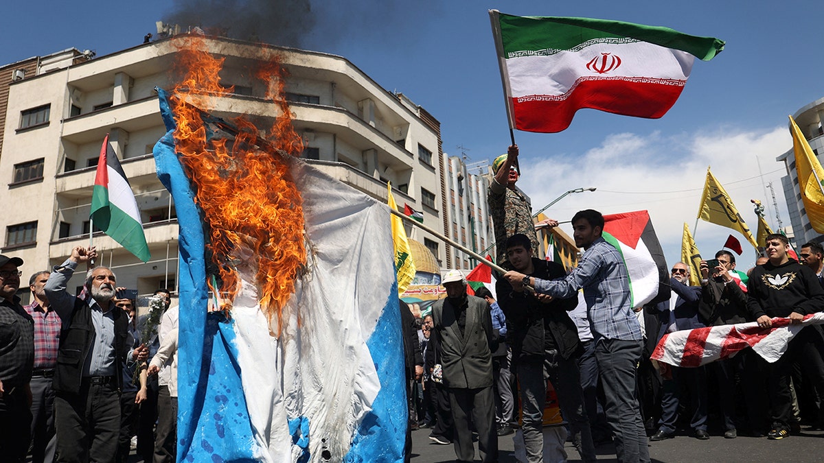 Iranians attend a rally marking Quds Day