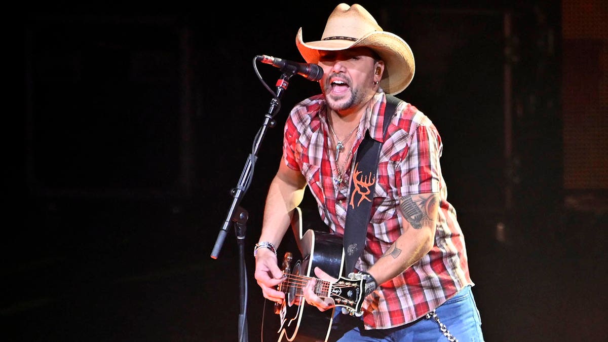 jason aldean performing in red, white and blue