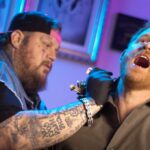 Jelly Roll gives Prince Harry neck tattoo as royal jokes he should have gotten it on his a–