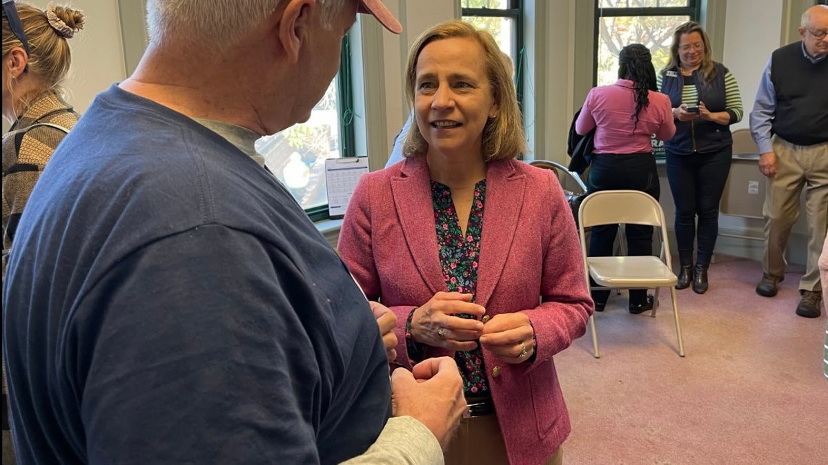 Former Manchester Mayor Joyce Craig, the Democratic gubernatorial nominee in New Hampshire, speaks with voters in Concord, N.H., Oct. 6.