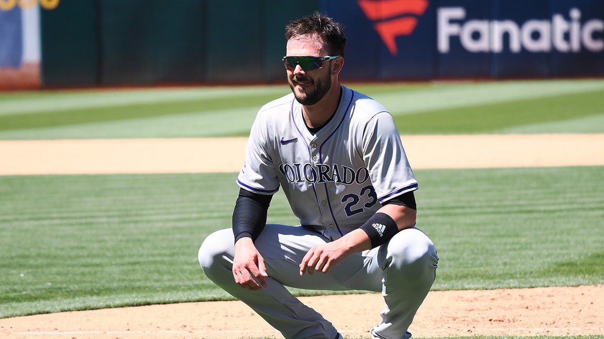 Kris Bryant squats on infield