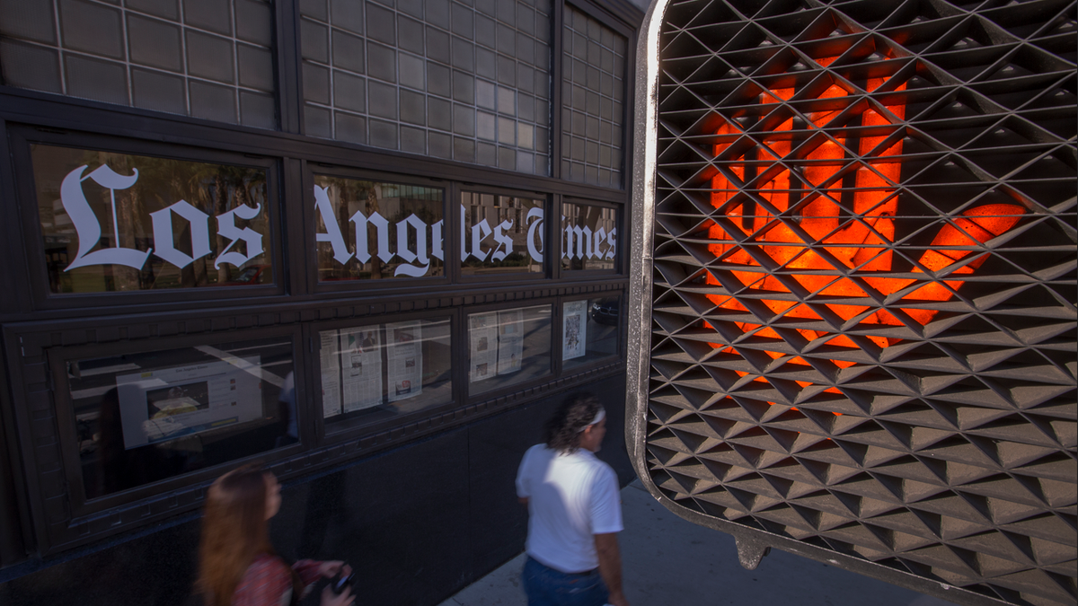 a stop sign near an LA Times office