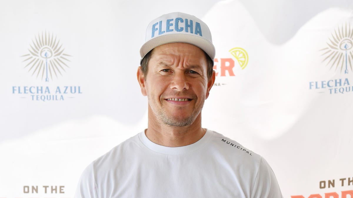 Mark Wahlberg in a white t-shirt and hat