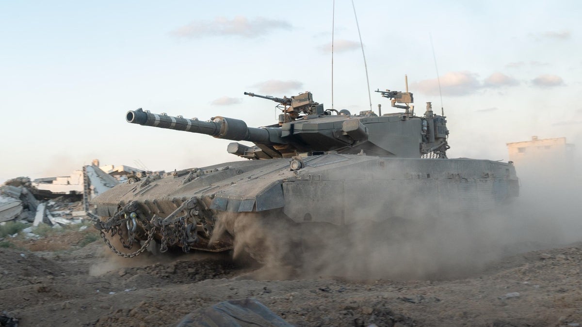 An IDF tank rolls through the Netzarim Corridor in Gaza. (Photo: IDF Spokesman's Unit.)