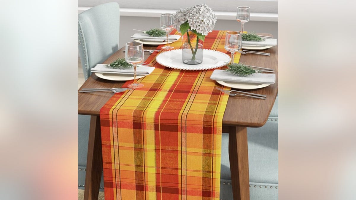 Outfit your table with a fall-themed tablecloth. 