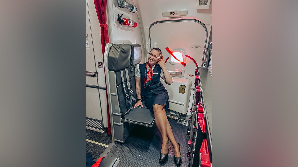 Mina Farmen Bertheussen poses for a photo while working as a flight attendant.