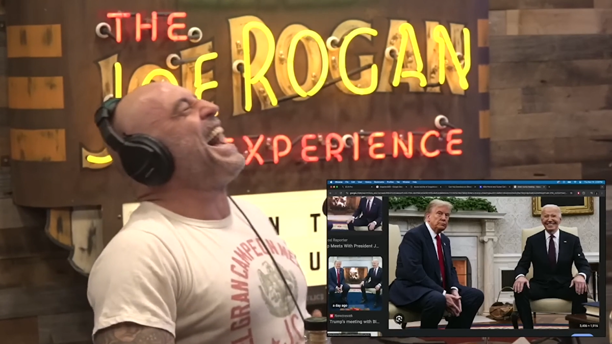 Rogan laughs as he views a photo of Biden smiling with Trump