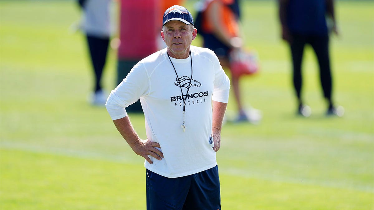 Sean Payton looks on at training camp