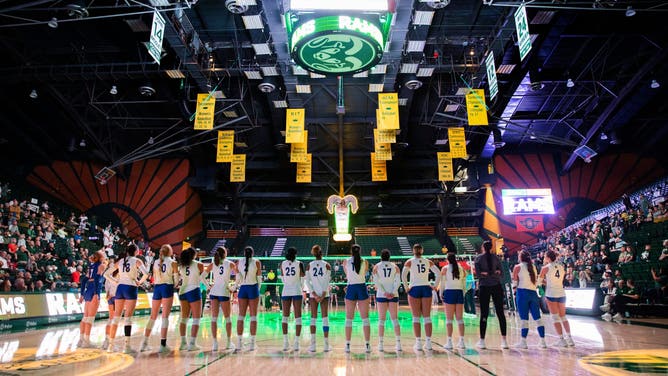 The San Jose State University Spartans volleyball team lines up for the playing of the national anthem and player introductions for their NCAA Mountain West match against the Colorado State University Rams.