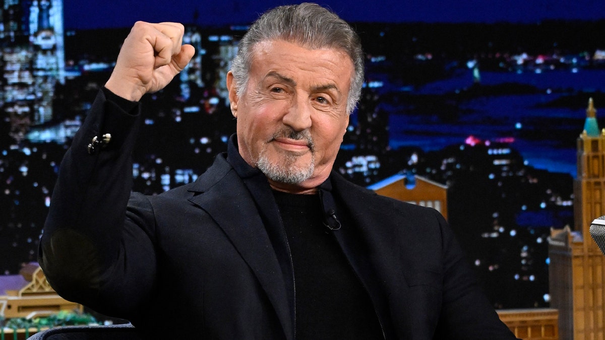 Sylvester Stallone raises his fist