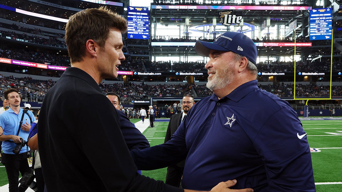 Tom Brady visits with Mike McCarthy