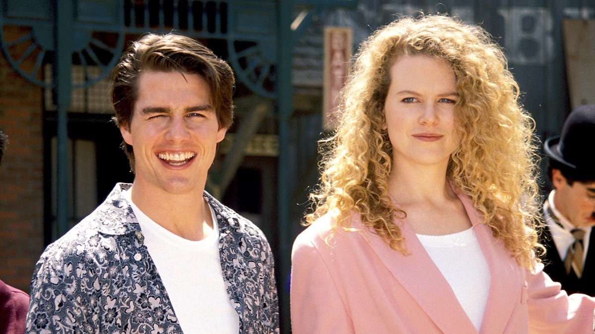 Tom Cruise and Nicole Kidman smile in a photo