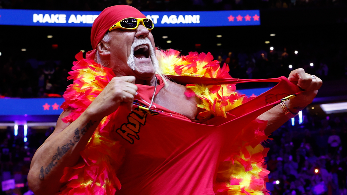 Hulk Hogan with a fake lei rips his red shirt at the Trump Rally at Madison Square Garden