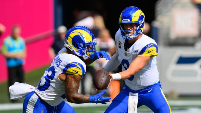 Los Angeles Rams QB Matthew Stafford hands it off to RB Kyren Williams against the Seattle Seahawks at Lumen Field. (Steven Bisig-USA TODAY Sports)