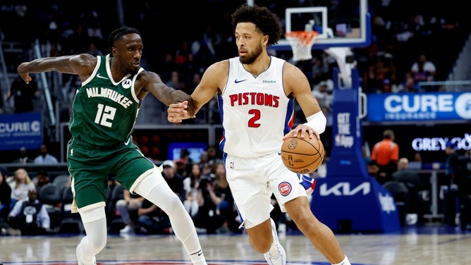 Detroit Pistons PG Cade Cunningham drives past Milwaukee Bucks wing Taurean Prince at the Little Caesars Arena. (Rick Osentoski-Imagn Images)