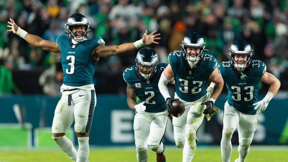 Philadelphia Eagles safety Reed Blankenship celebrates with teammates after his interception during the fourth quarter against the Washington Commanders at Lincoln Financial Field. Mandatory Credit: Bill Streicher-Imagn Images