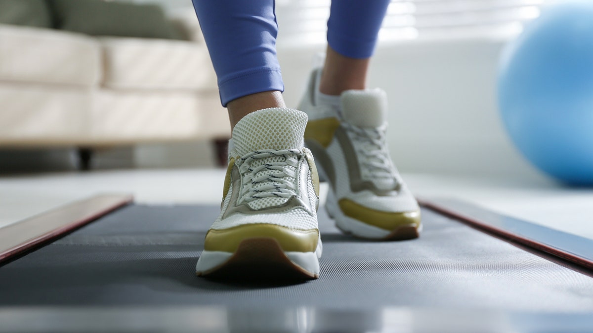 Close-up of sneakers on walking pad