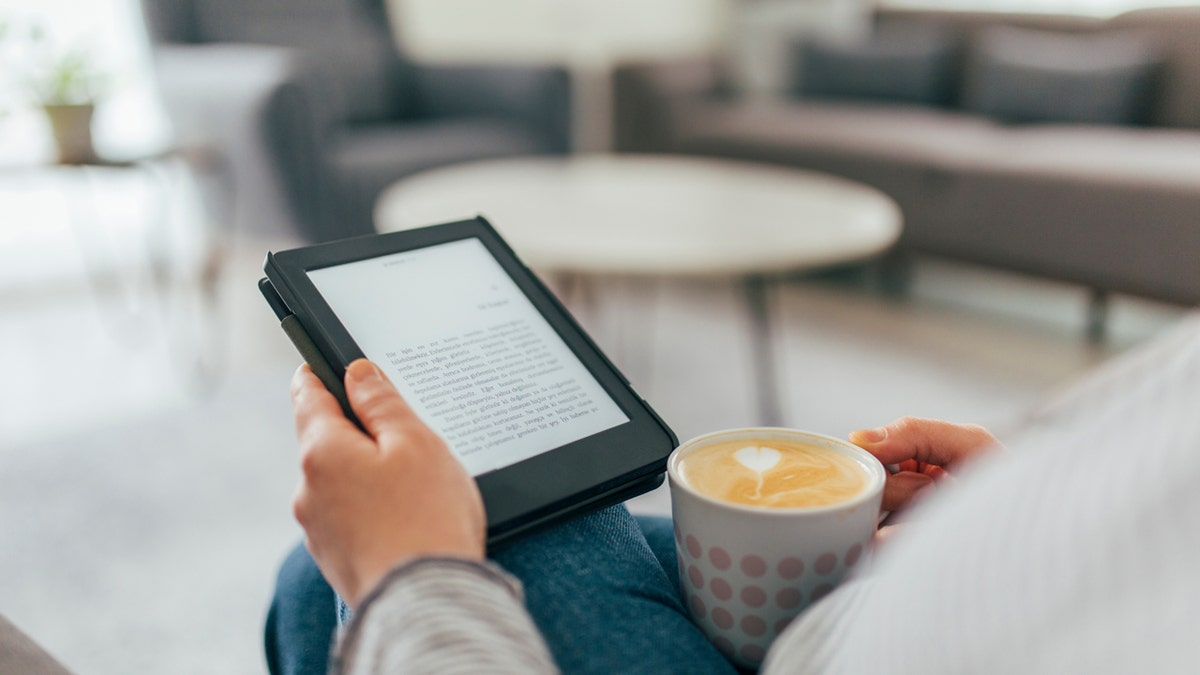 Woman reading on a Kindle