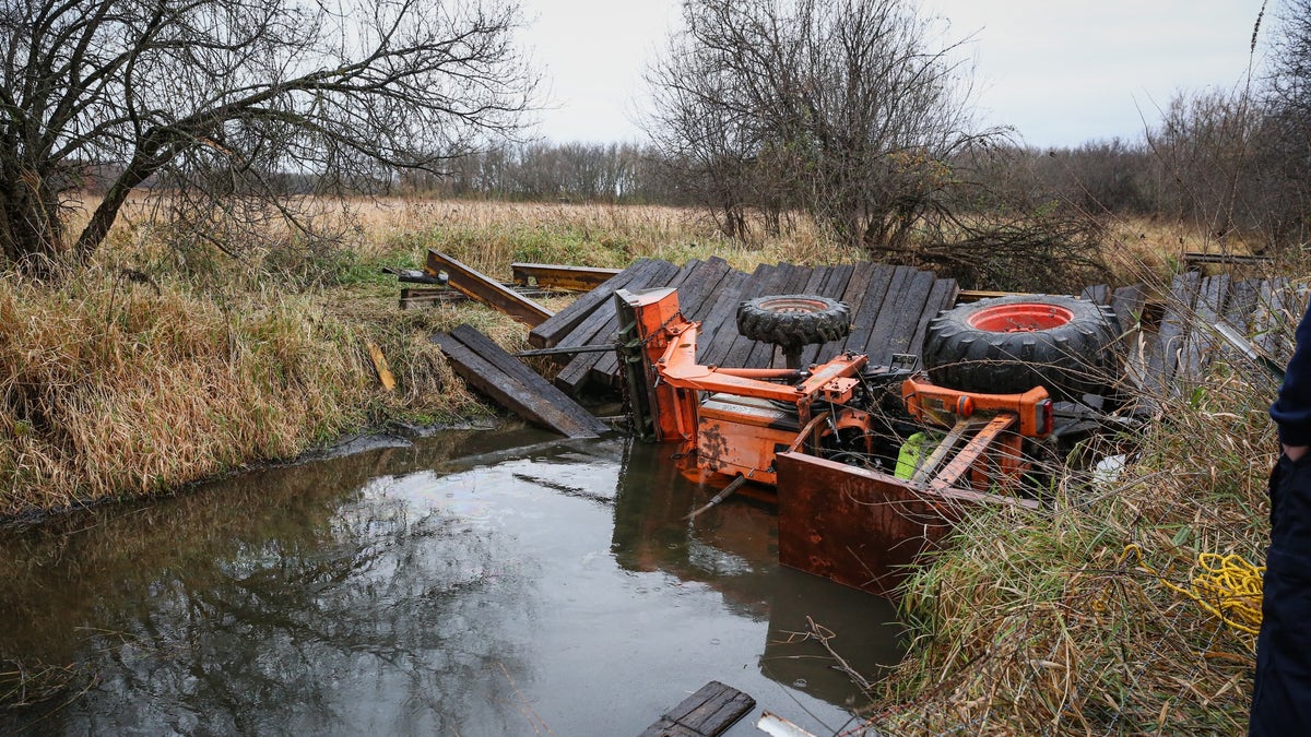 Tractor in creek after bridge collapses