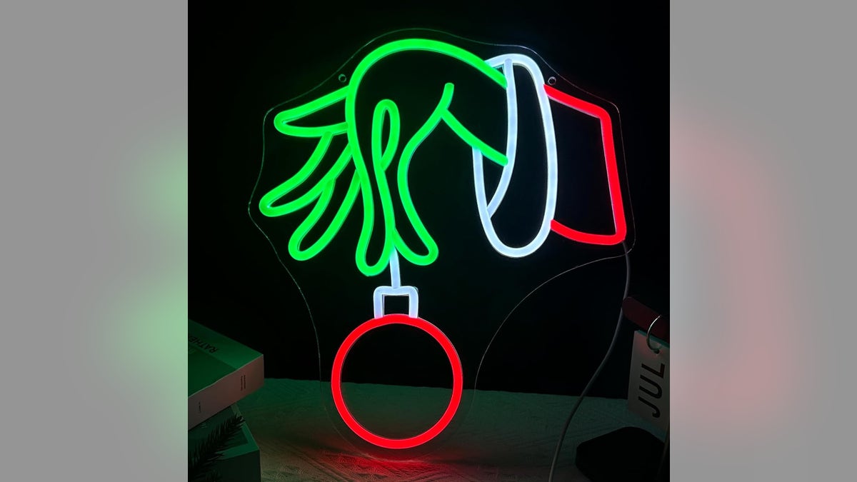 A trendy neon sign brings a fun retro vibe to indoor and outdoor holiday displays.