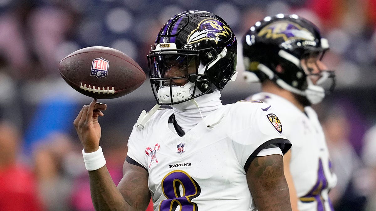 Lamar Jackson spins the ball