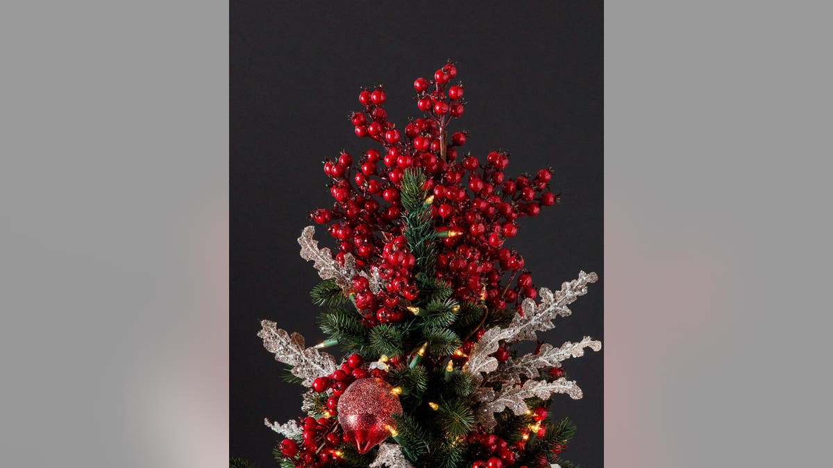 Try a cranberry bouquet tree topper instead of an angel or star to make a statement this year.