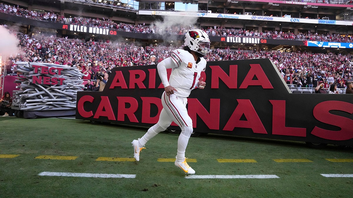 Kyler Murray runs onto the field