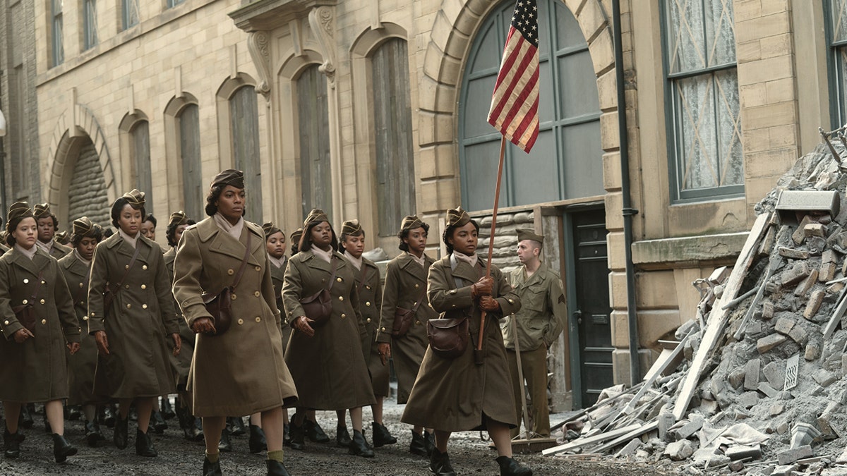 The 6888th postal battalion marches down a street in a scene from Netflix's 