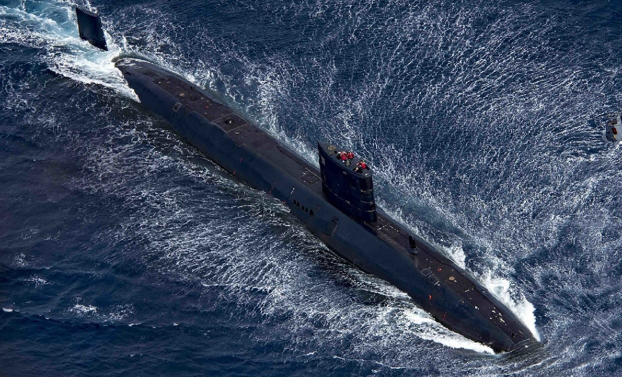 Royal Navy Trafalgar-class submarine HMS Trenchant and Royal Navy Wildcat HMA2, attached to Type 23 frigate HMS Iron Duke (F234), participate in a passenger exchange during exercise Saxon Warrior 2017, Aug. 5. Saxon Warrior is a United States and United Kingdom co-hosted carrier strike group exercise that demonstrates interoperability and capability to respond to crises and deter potential threats.