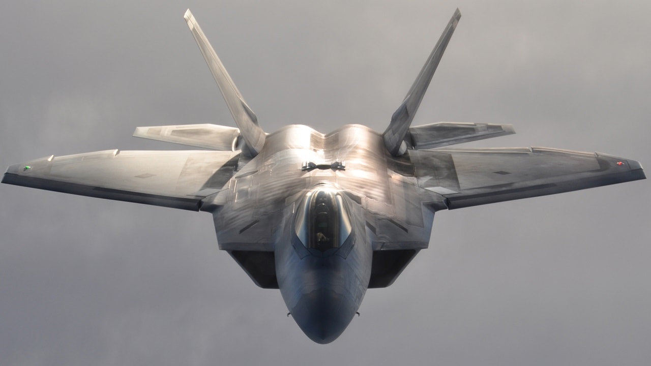 A U.S. Air Force F-22 Raptor fighter aircraft flies over Alaska terrain after refueling Jan. 5, 2013. The F-22 is assigned to the 3rd Wing and flown by a Reserve pilot assigned to the 302nd Fighter Squadron at Elmendorf Air Force Base, Alaska. (U.S. Air Force photo by Tech. Sgt. Dana Rosso)