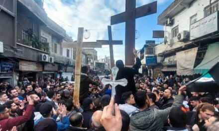 Syrian Christians protest in Damascus after arsonists torch Christmas tree