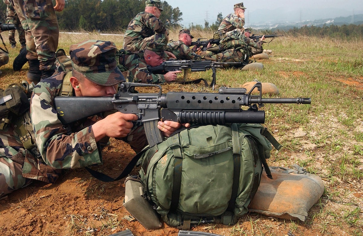 US Marine Corps (USMC) members from L Company, 3rd Battalion, 3rd Marine Regiment, 3rd Marine Division, perform a biathlon on the Camp Hansen ranges, firing a Colt 5.56mm M16A2 Assault Rifle.