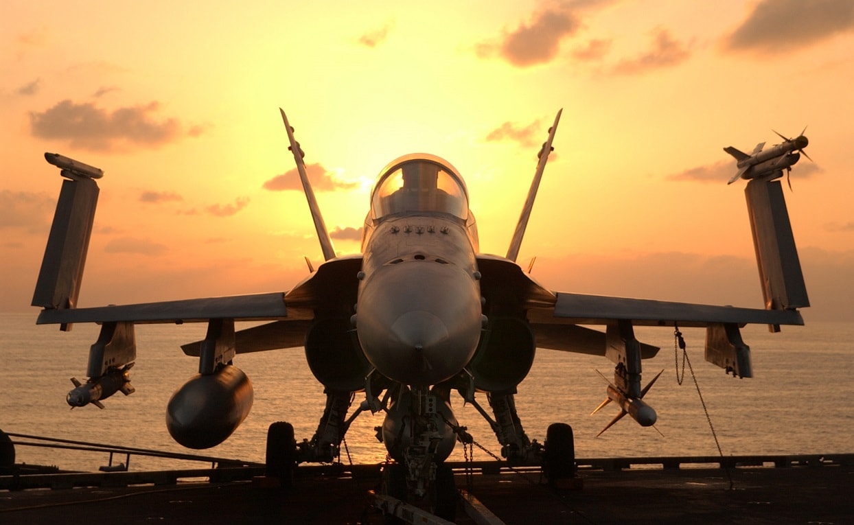 At sea aboard USS John C. Stennis, December 18, 2001 - After an early morning round of flight operations, an F/A-18 Hornet awaits the next round of combat flight operations aboard the USS John C. Stennis (CVN 74). Stennis and her embarked Carrier Air Wing Nine (CVW-9) are supporting Operation Enduring Freedom. U.S. Navy photo by Photographer's Mate 3rd Class Jayme Pastoric.