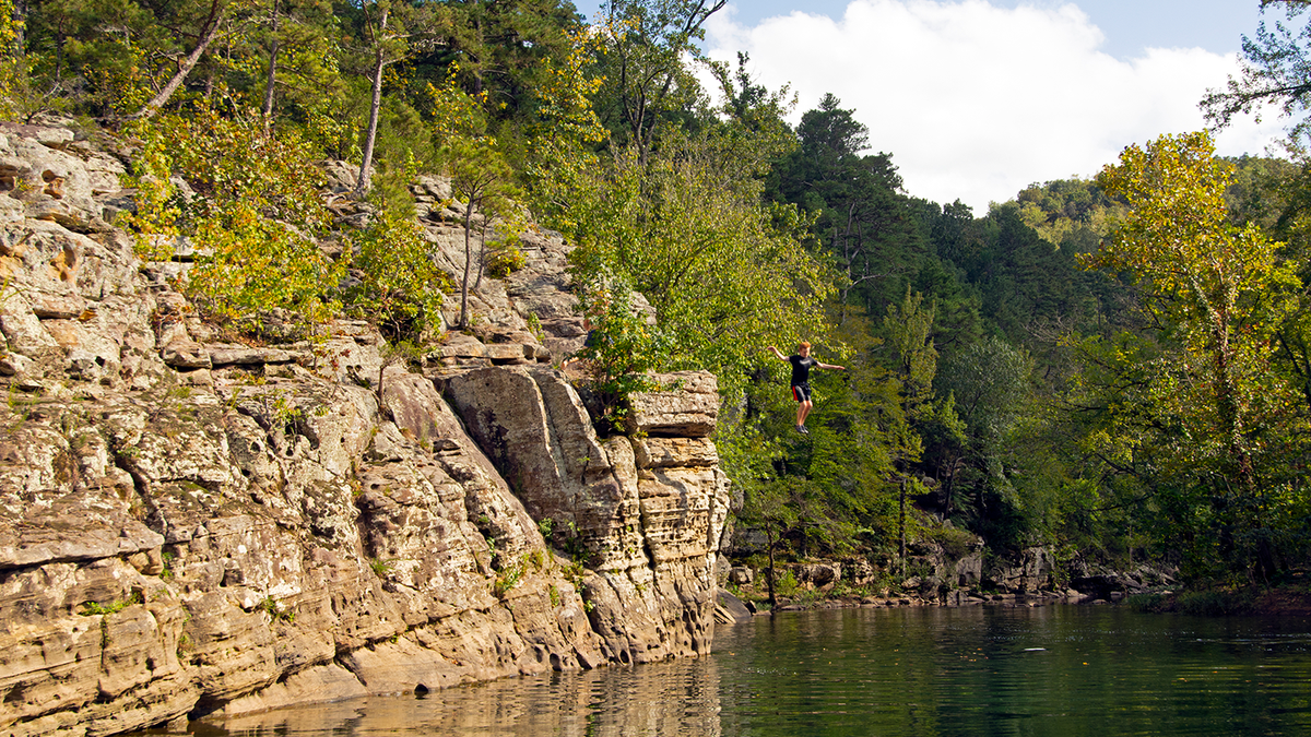 Boy jumps into Arkansas river