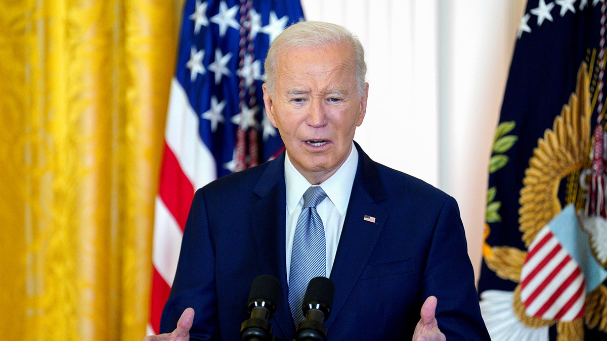 Biden speaking inside the White House