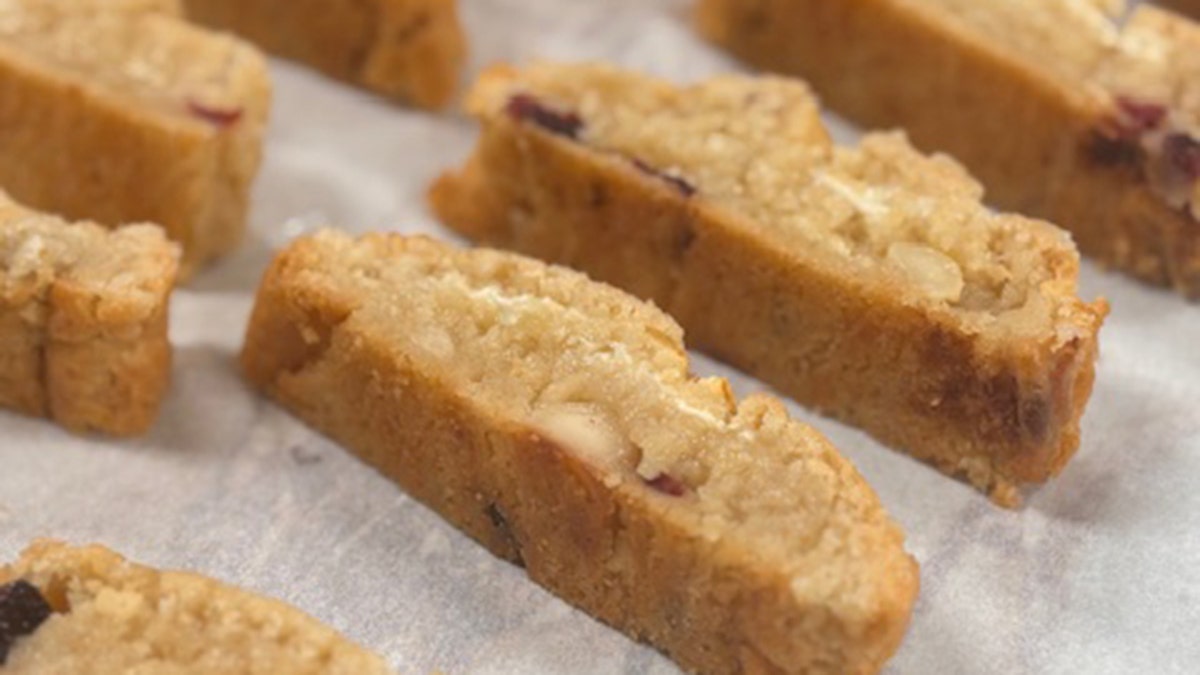 Biscotti laying on a baking sheet.