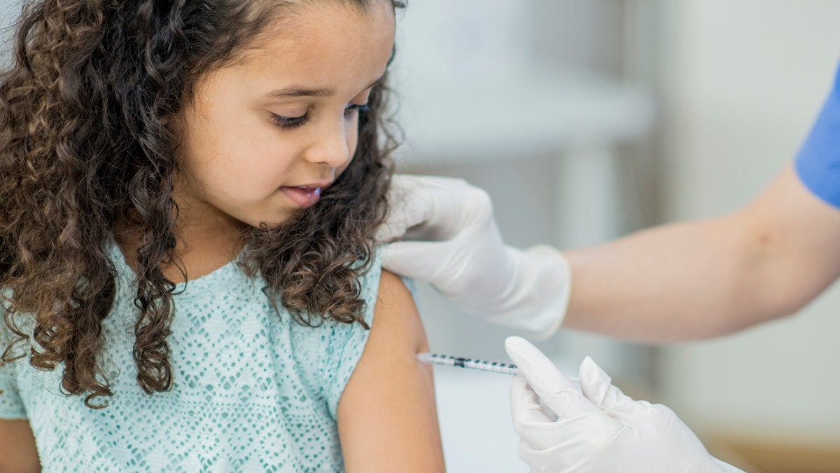 girl getting a vaccine 