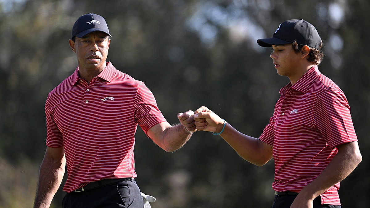 A Woods fist bump