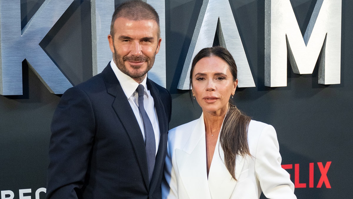 David and Victoria Beckham posing at the premiere of 